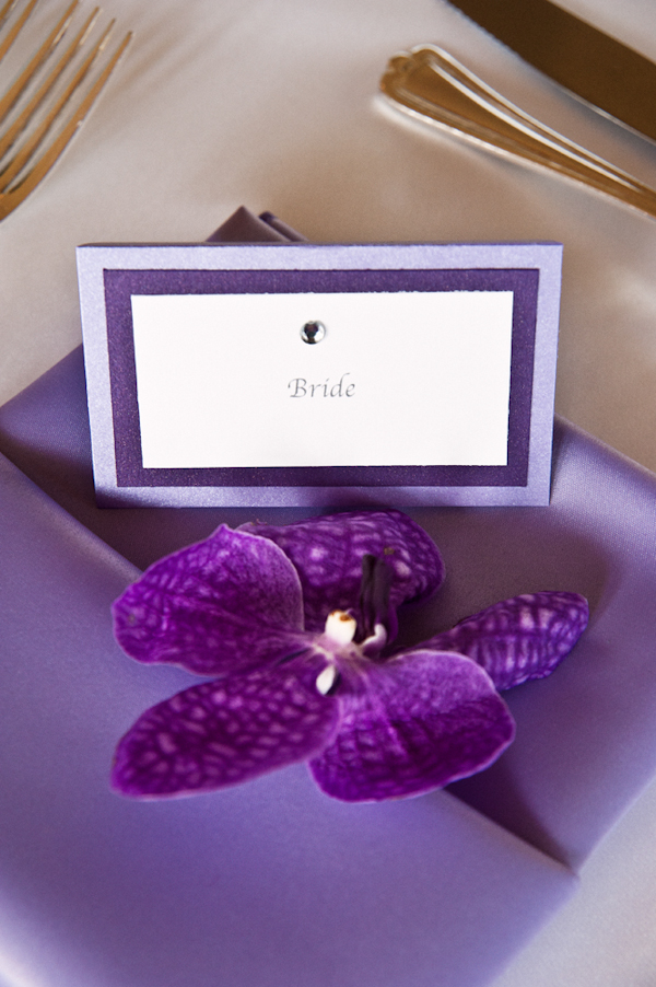 lavender and purple table setting with place card for Bride and purple flower accent - Honolulu destination wedding photo by top Hawaiian wedding photographer Derek Wong